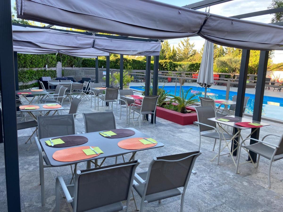 Logis Hotel Restaurant Les Aubuns Caissargues Exteriör bild